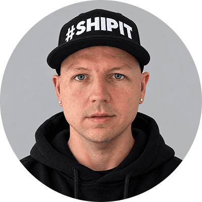 Man wearing black cap with #SHIPPIT logo for Ship It Nation branding.